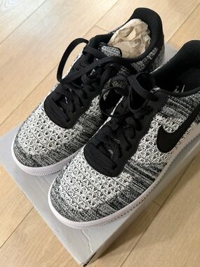 **New** Still in box. Nike Kids Black and White Knit Sneaker with Swoosh.